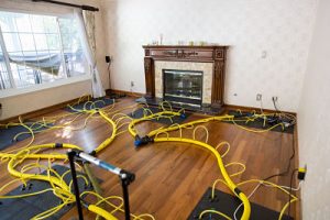 water damage restoration equipment in a living room